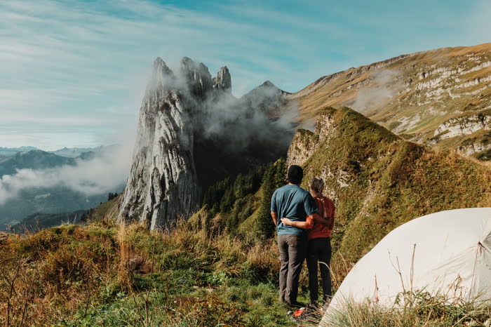 Embracing on Schiffler Ridge with jagged peaks behind